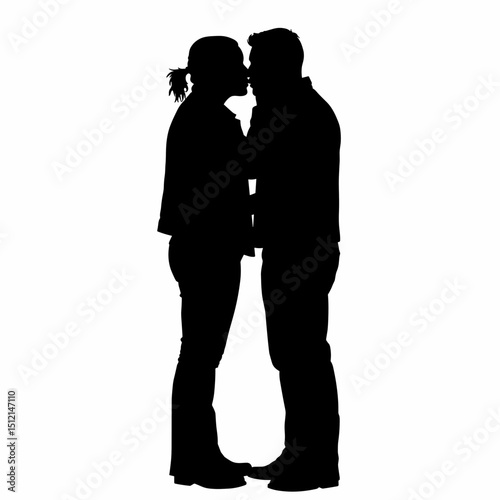 Silhouette of young couple kissing in a romantic embrace