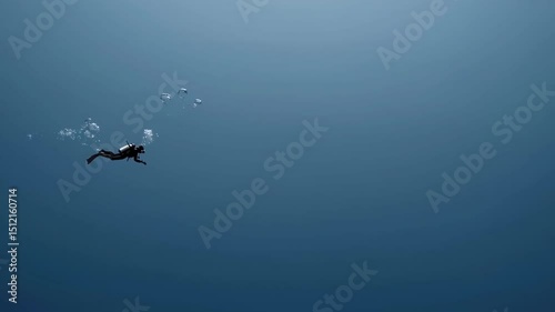 Tiny Scuba Diver Exploring Blue Ocean Depths