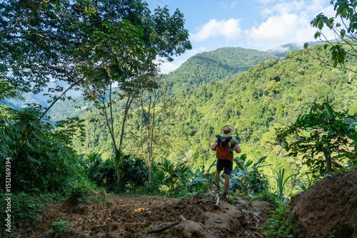hiker in the mountains in jungle walkink in trek to ciudad perdida lost city in sierra nevada of santa marta in colombia 
