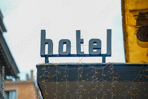hotel. hotel logo. entrance with light garlands. detail.