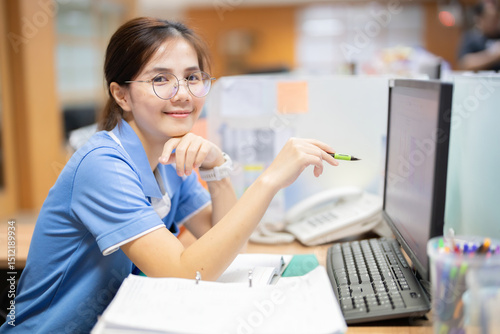 As part of her daily routine, the female employee checks her computer for new document updates, schedules business meetings, and plans her work tasks accordingly each morning.