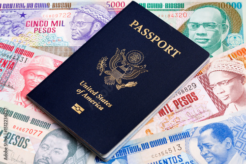 American passport on a Guinea Bissau money