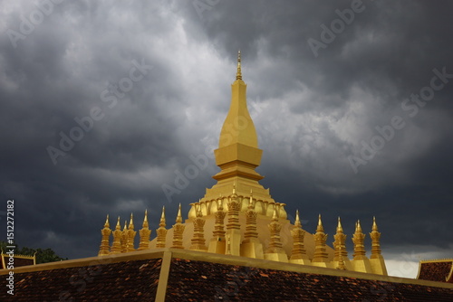 dark cloud on top of That Luang Stupa, Vientiane, Laos