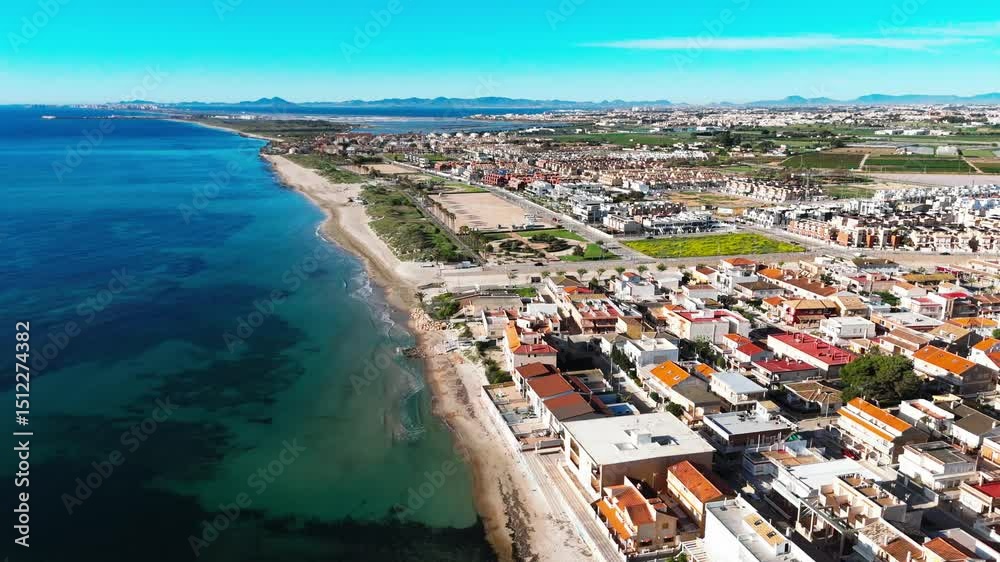 Aerial shot, drone point of view of Torre de la Horadada, Spanish town located on Mediterranean Sea. Costa Blanca. Spain