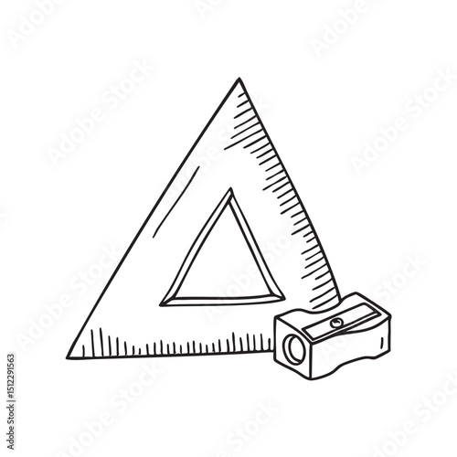 A triangle ruler lying near a pencil sharpener