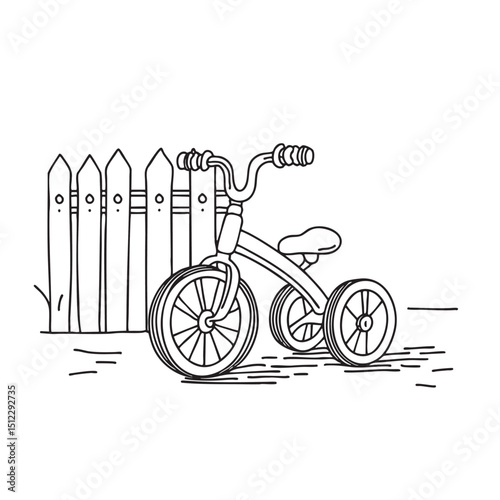 A tricycle parked near a garden gate