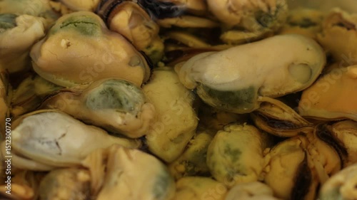 Fresh mussels prepared for cooking at a seaside market