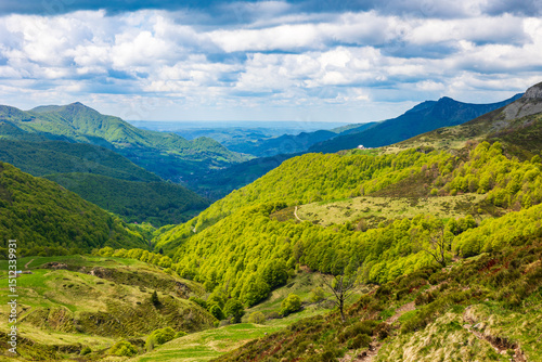 Verdant panorama of the Jordanne Valley from the ridge between Puy de Peyre Arse and Puy Mary