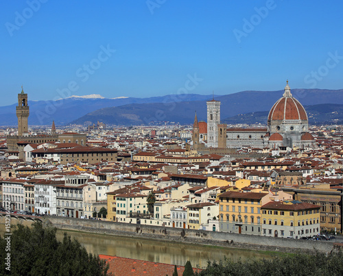 Wide view of Florence City in Central Italy with many famous landmarks Tower of OLD Palace and the Dome of The Cathedral with vibrant and vivid colors photo
