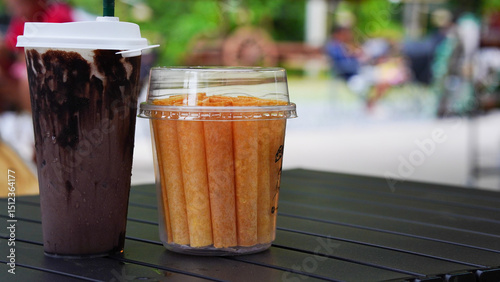 Iced cocoa and snacks are placed on the table.