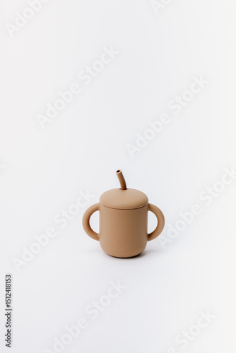 Brown silicone sippy cup with straw