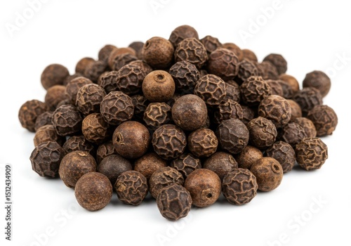 Aromatic heap of whole allspice berries isolated on white