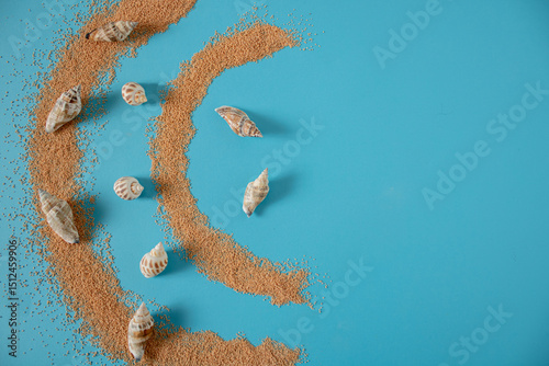 Sea sand with shells in blue salt water