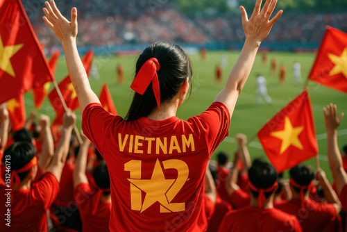 Vietnam Fan Raising Arms in Stadium Celebration


