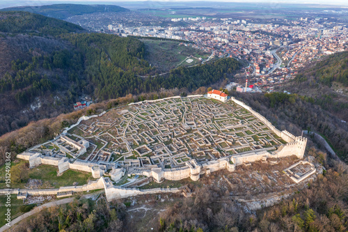 Aerial view ancient fortress from 8th century on top of a hill and city Shumen, BulgariaAerial view ancient fortress from 8th century on top of a hill and city Shumen, Bulgaria