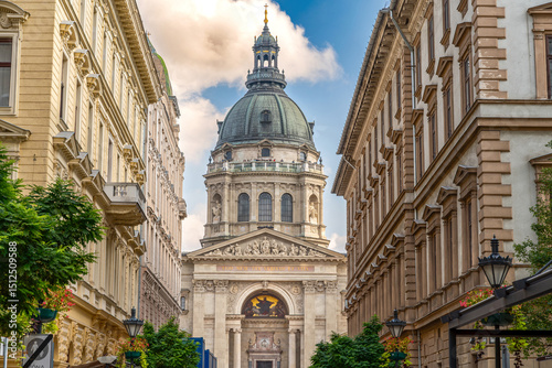 St. Stephen's Basilica in Budapest, Hungary, captured under a bright sky with soft clouds highlighting its magnificent architecture