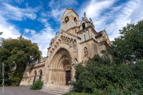 Stunning view of Jaki Chapel, set against a cloudy sky, showcasing the architectural beauty of Budapest, Hungary