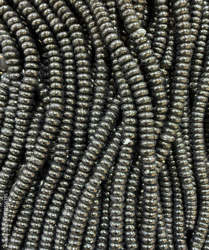 Stringed artificial glossy black and silver beads