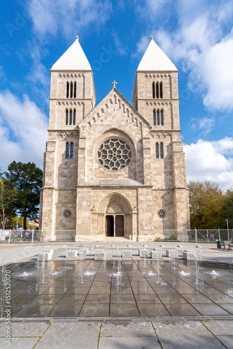 The Parish Church of St. Margaret in Budapest, Hungary, with a beautiful fountain in the foreground, enhancing the architectural beauty of the church and its serene surroundings