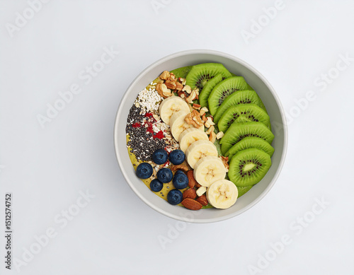 Delicious green smoothie bowl with kiwi banana and berries