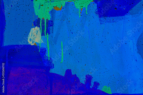 Fototapeta Naklejka Na Ścianę i Meble -  Messy multicolor brush strokes. Light blue, white, neon green paint drips, flows, streaks on wall outdoors