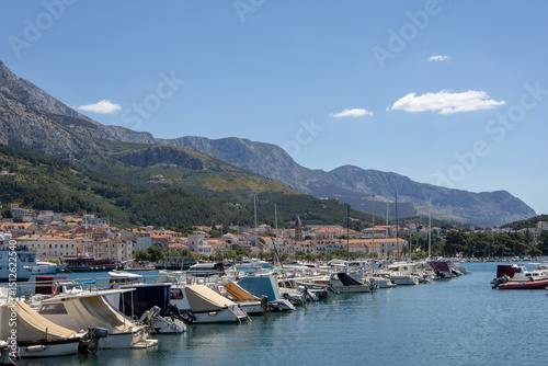 Fototapeta Naklejka Na Ścianę i Meble -  Amazing seascape of Adriatic sea. Near Makarska beach Croatia, Europe. Colorful summer view of small beach. Croatian coast with clear water and pine trees around.