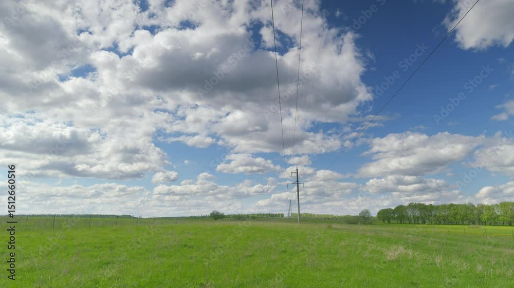 An Expansive, Lush Green Field Spreading Out Beneath A Beautifully Cloudy, Serene Sky Above Time lapse. An Expansive, Lush Green Field Spreading Out Beneath A Beautifully Cloudy, Serene Sky Above Time lapse.