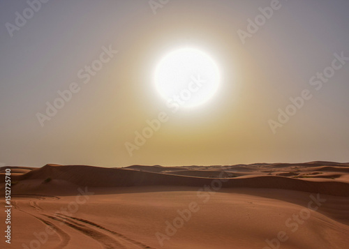 big sun in the desert before sunset