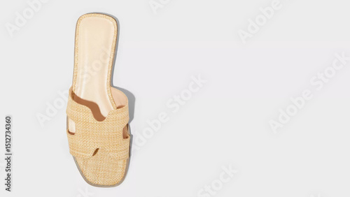Stylish beige slide sandal designed for summer outings, showcasing a woven texture and open-toe style for comfort and breathability photo