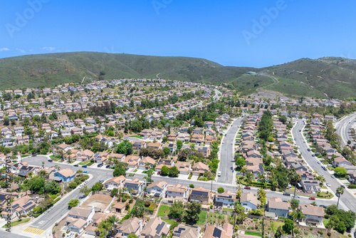 Aerial view of San Marcos neighborhood with houses and street during sunny day, South California, USA.