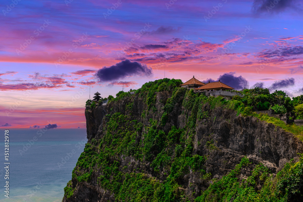 Uluwatu Temple in Bali the land of the Gods. Sitting on top of a forest cliff overlooking turquoise blue beach. beautiful colourful skies of Bali island Indonesia Uluwatu Temple in Bali the land of the Gods. Sitting on top of a forest cliff overlooking turquoise blue beach. beautiful colourful skies of Bali island Indonesia