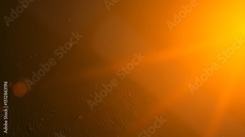 Abstract image of warm, vibrant orange and dark brown tones, with lens flares and subtle patterns