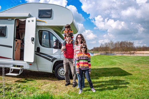 Family vacation, RV travel with kids, happy parents with children have fun on holiday trip in motorhome, camper exterior