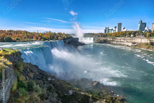 View of Niagara Falls from American side, giant water falls on clear sunny day, Buffalo city, New York, USA