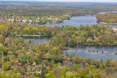 aerial of Wannsee in Berlin with villas in green area with trees and boats at the lake
