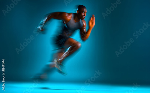 Motion blurred photo of male runner running in action pose with fast pace on bright blue gradient background. Commercial sports photography style.