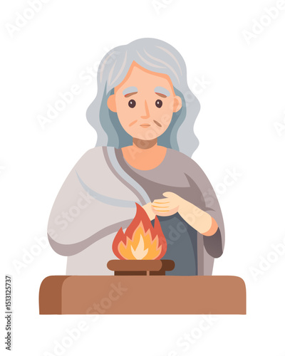 Elderly woman warming hands over fire in traditional robe