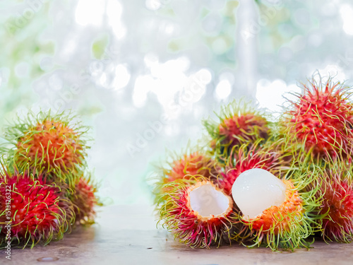 Close-up ripe rambutans on the wooden table.