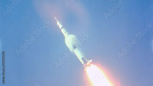 The Saturn V rocket flying towards the moon.