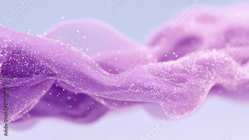 Abstract light purple fabric motion with shimmering particles creates a delicate and elegant visual.