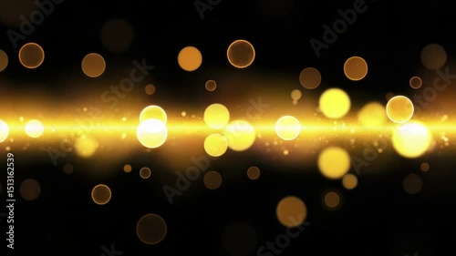 Golden light shines creating a magical and festive atmosphere with bokeh effect on a dark backdrop.