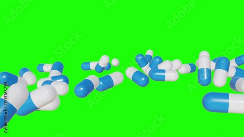 pills falling down on green background. Colorful capsules and tablets falling on a surface 4k Video. symbolizing medicine and drug treatment, Drugs, pills, tablets, medicine concept. 3d render