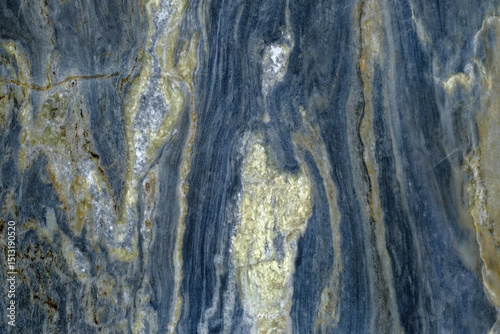 Abstract stone background. Close up of a naturally formed colorful rock with textures and patterns