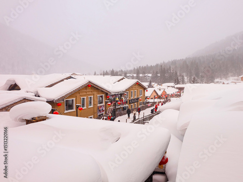 China snow town, mushroom houses covered by pure white snow in the mountain of a Chinese countryside 