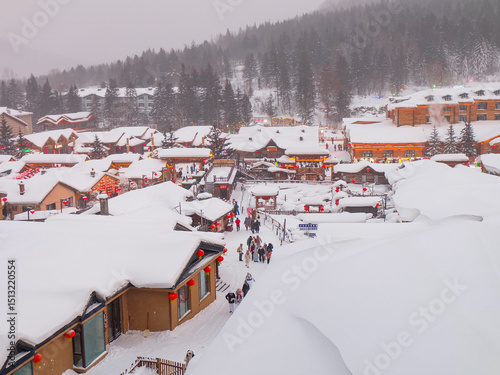 China snow town, mushroom houses covered by pure white snow in the mountain of a Chinese countryside 