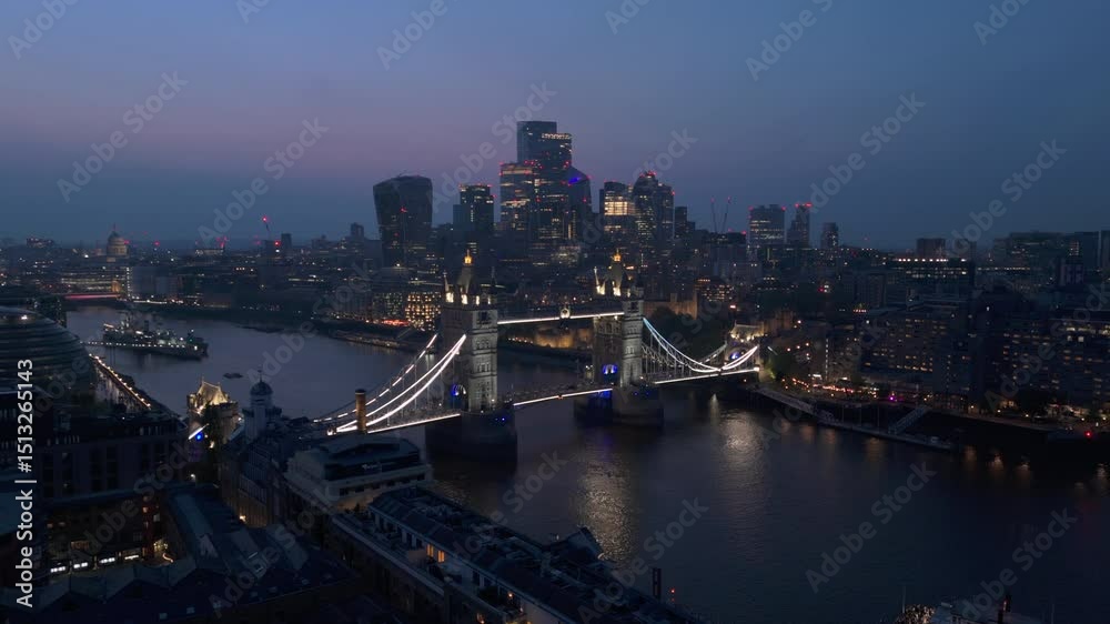 Embark on an adventure to discover and explore breathtaking twilight aerial shots that beautifully showcase the stunning Tower Bridge and the vibrant London skyline that lines the River Thames