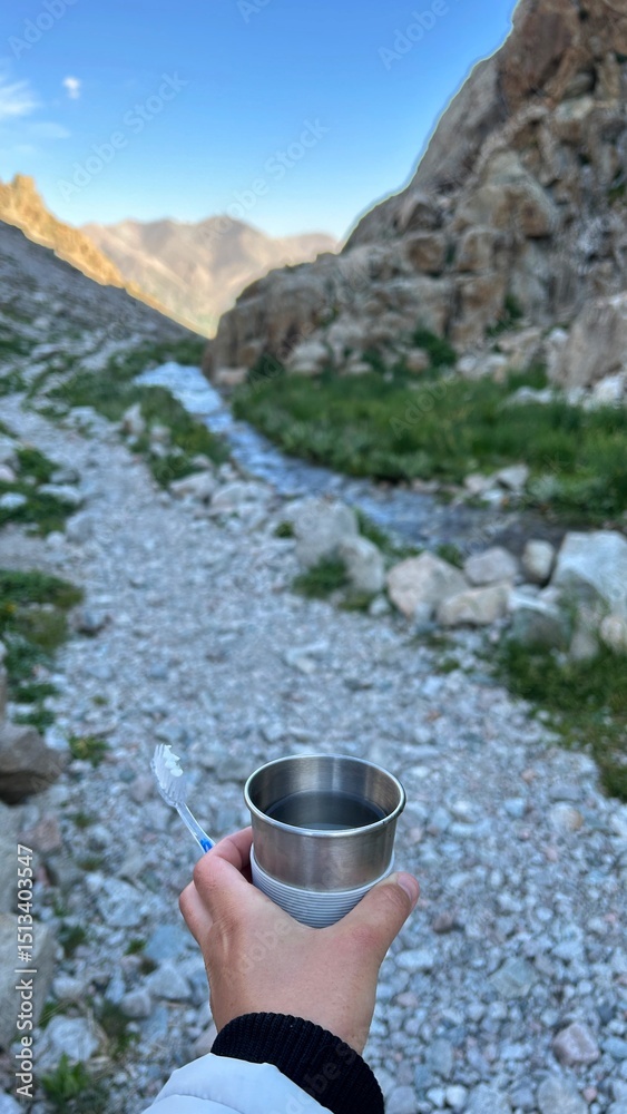 Obraz premium Kyrgyzstan, Ala Archa, Switzerland, Alps, waterfall in the mountains, beautiful sight, water stream flows in the grahs, mountain river beats on the rocks, fantastic nature