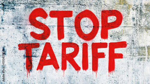 STOP TARIFF graffiti in red paint on urban concrete wall representing protest message and social resistance through street art photo