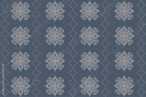 This fabric design features a central floral diamond motif on a rich blue background, accented with symmetric white and navy floral elements.