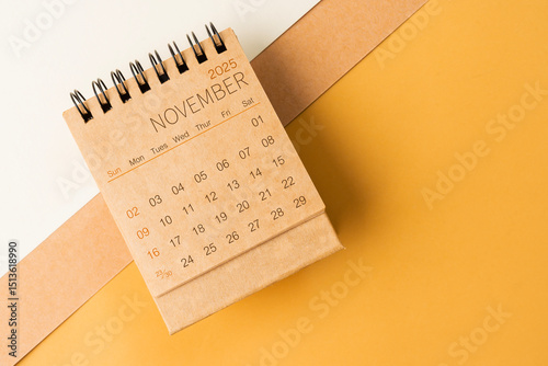 Wallpaper Mural Blank desk calendar for November 2025 on brown tone background. Torontodigital.ca